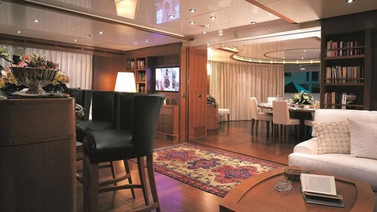 a living room with a couch and a tv aboard MORE Yacht for Sale