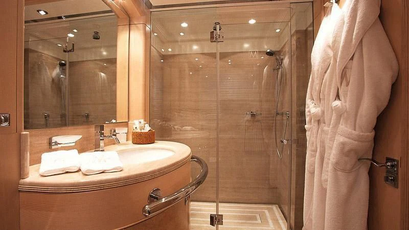 a bathroom with a large mirror aboard MORE Yacht for Sale