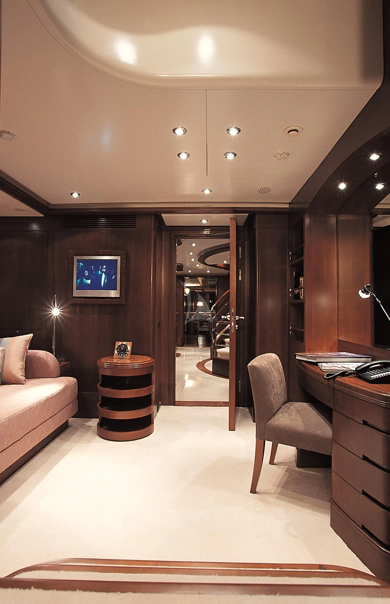 a living room with a large mirror aboard MORE Yacht for Sale