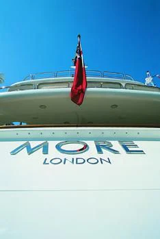 a red flag on a white wall aboard MORE Yacht for Sale