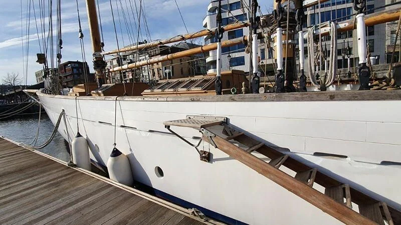 a large white boat in a dock aboard ZACA A TE MOANA Yacht for Sale