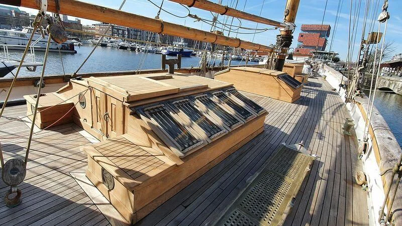 a wooden boat on a dock aboard ZACA A TE MOANA Yacht for Sale