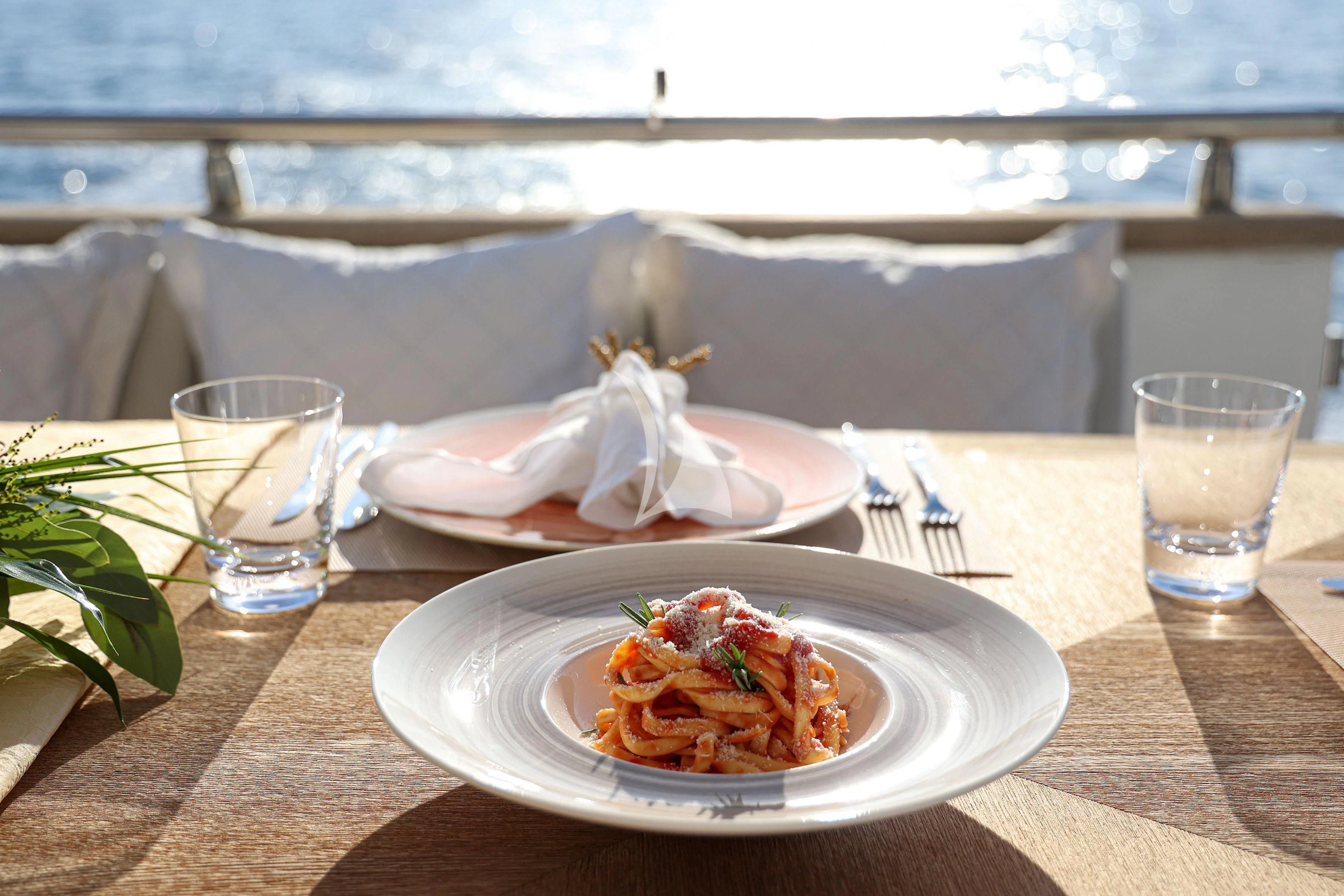 a plate of food on a table aboard WILLFUL Yacht for Sale