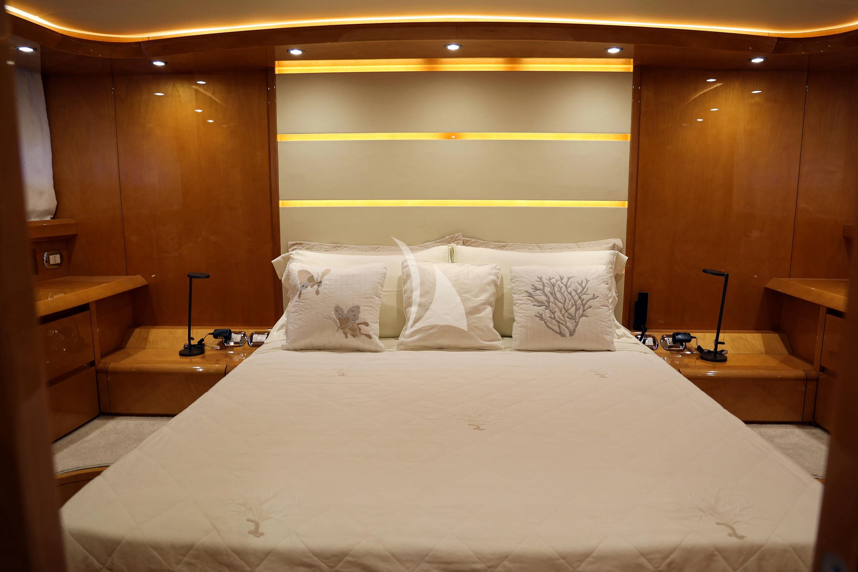 a bed with white sheets aboard WILLFUL Yacht for Sale