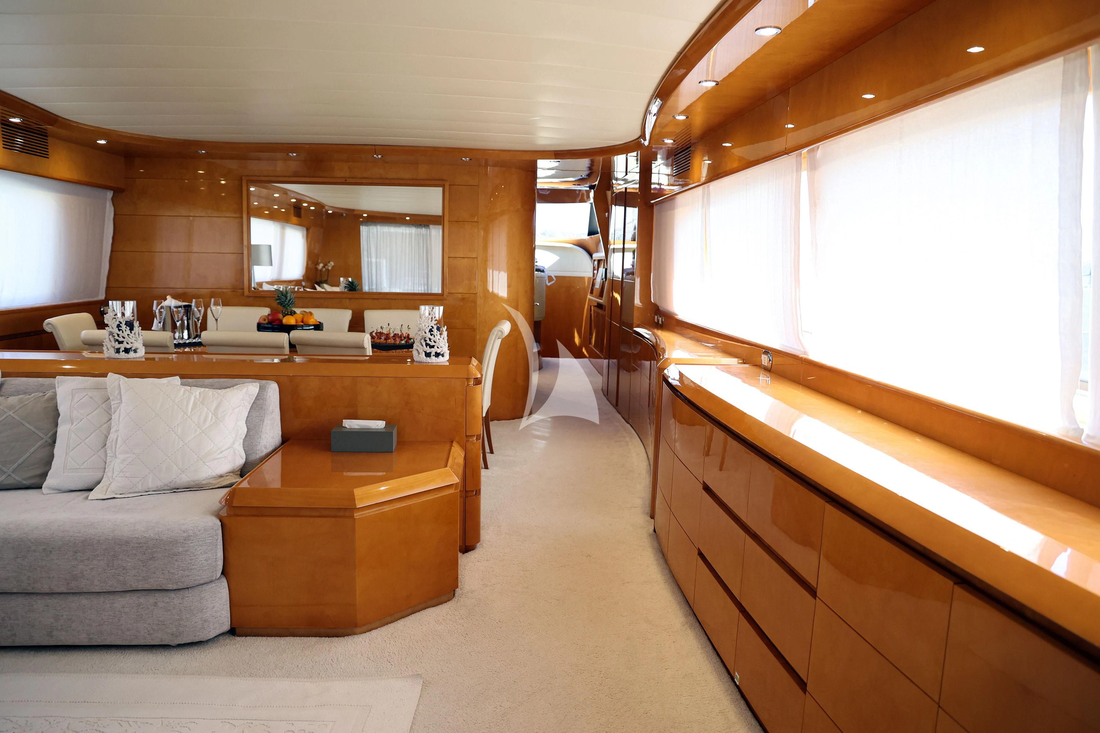 a living room with a couch and a piano aboard WILLFUL Yacht for Sale