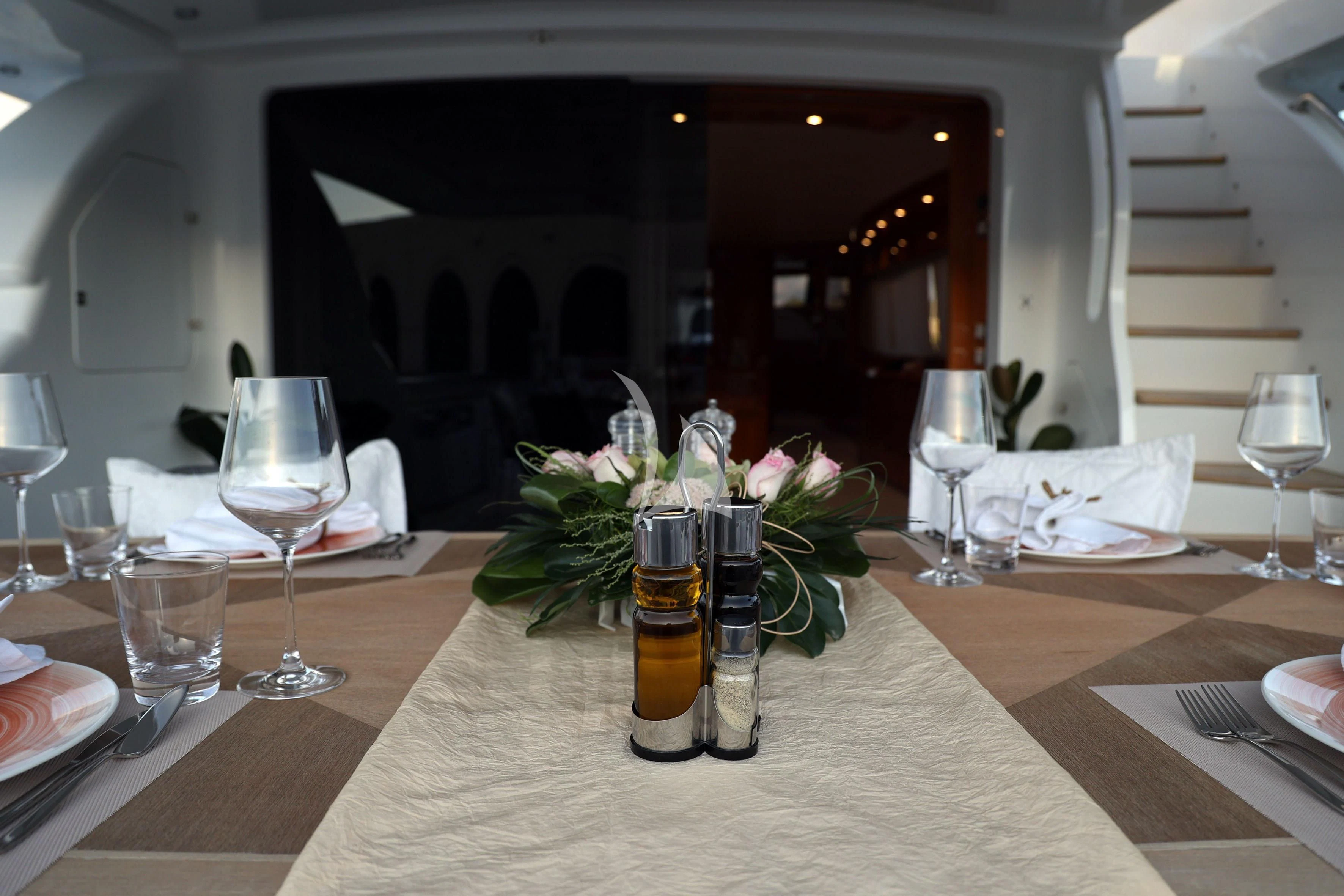a vase of flowers on a table aboard WILLFUL Yacht for Sale