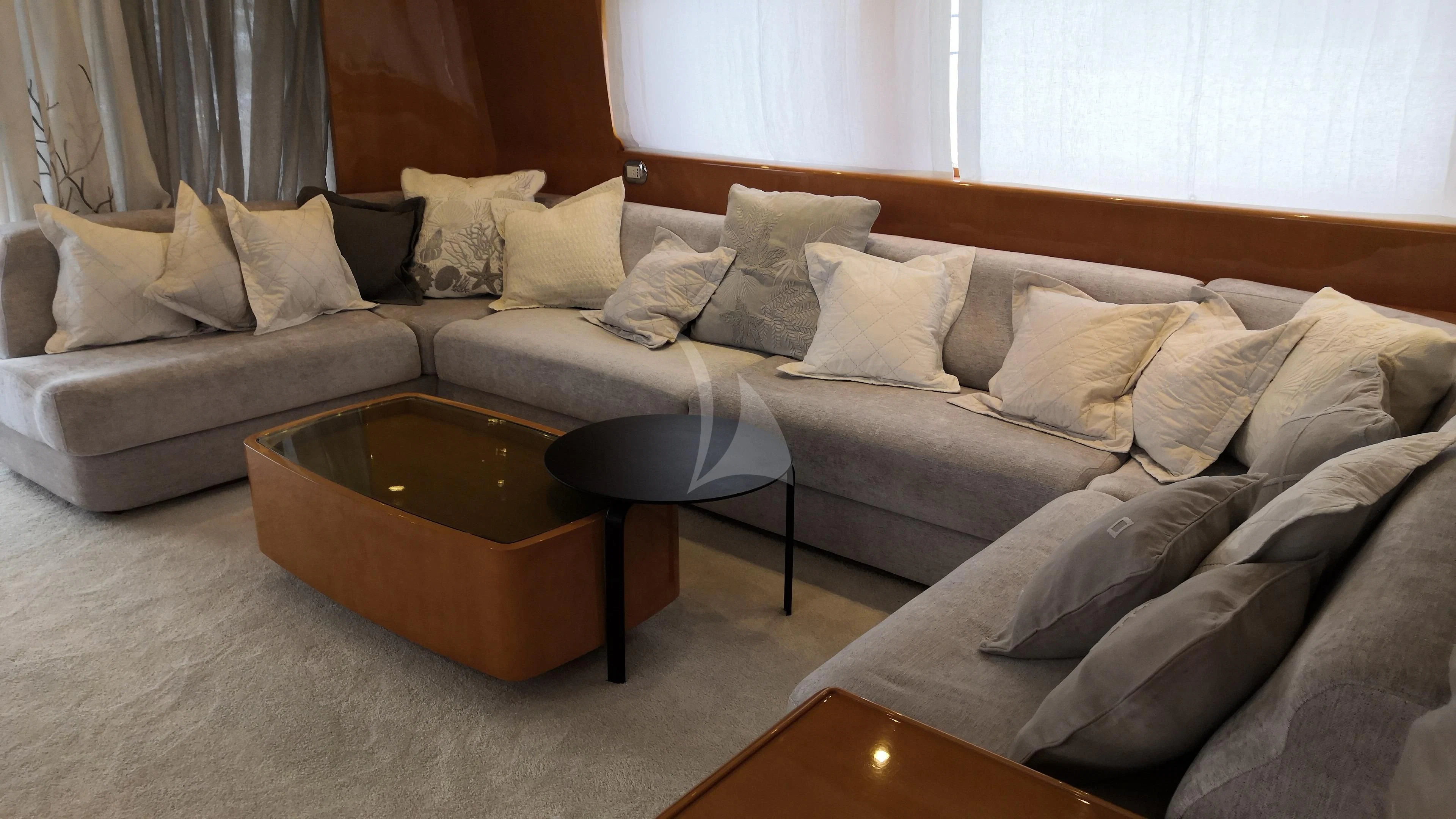 a couch with a coffee table aboard WILLFUL Yacht for Sale