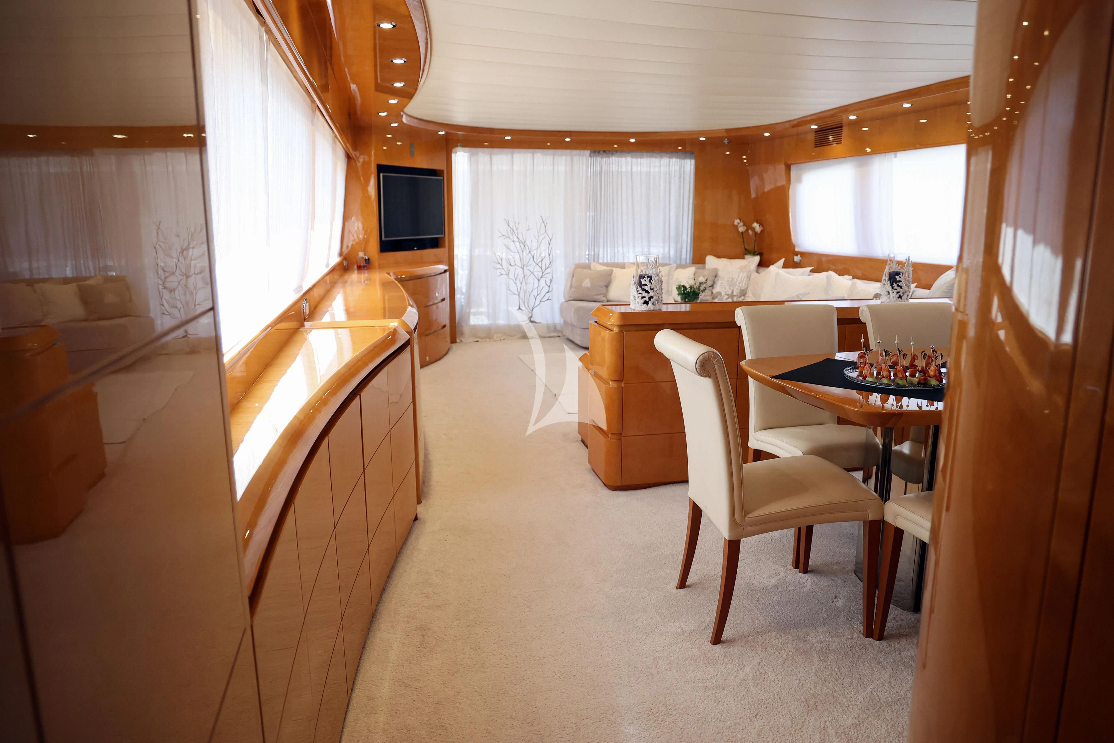 a room with a table chairs and a window aboard WILLFUL Yacht for Sale