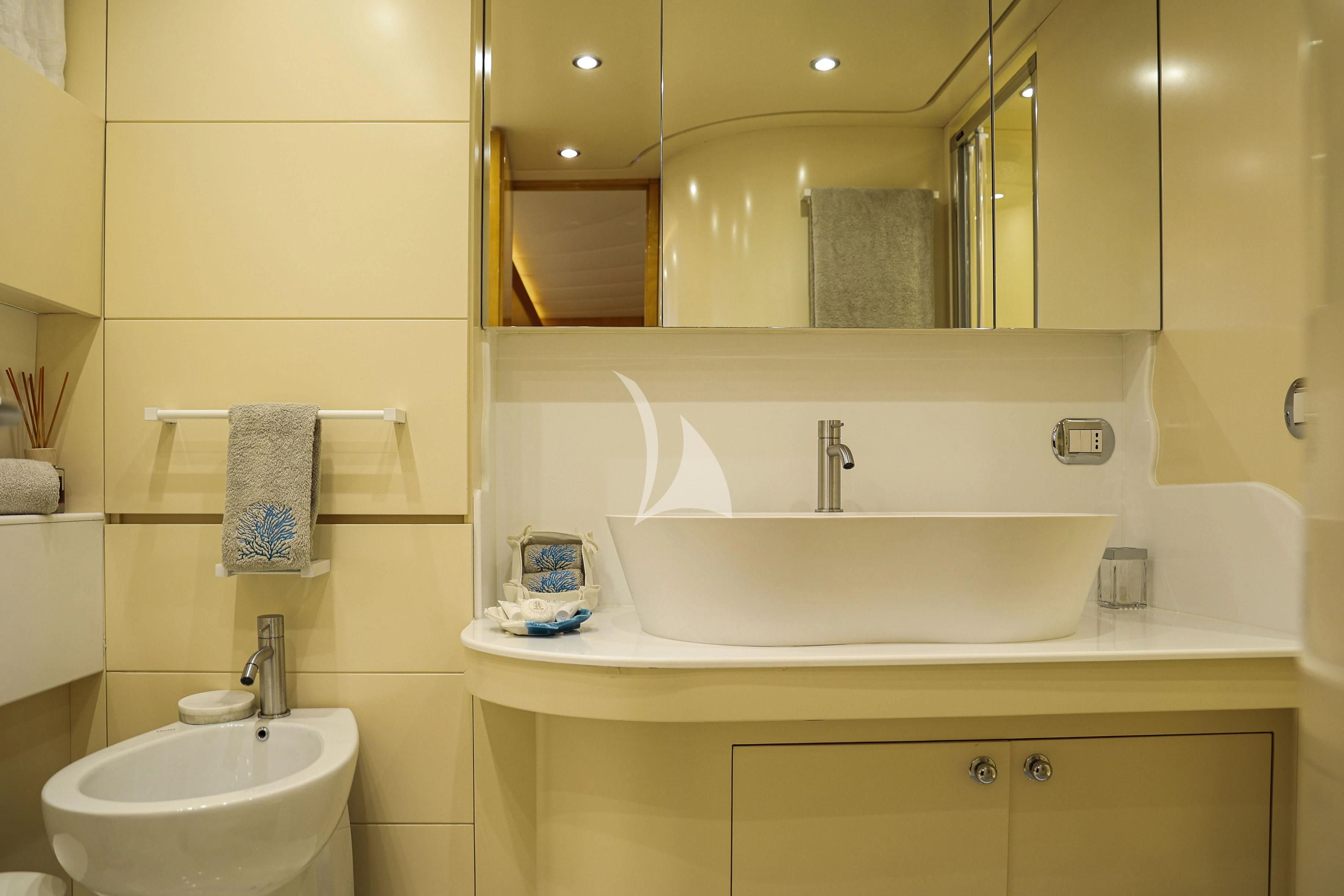 a bathroom with a large mirror aboard WILLFUL Yacht for Sale