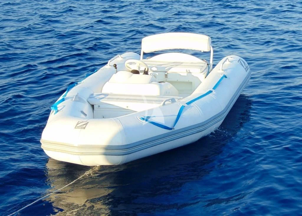 a white boat on the water aboard WILLFUL Yacht for Sale