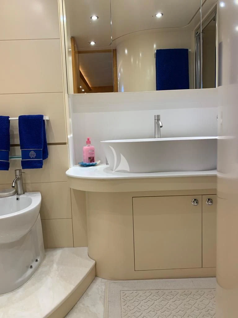 a bathroom with a large mirror aboard WILLFUL Yacht for Sale