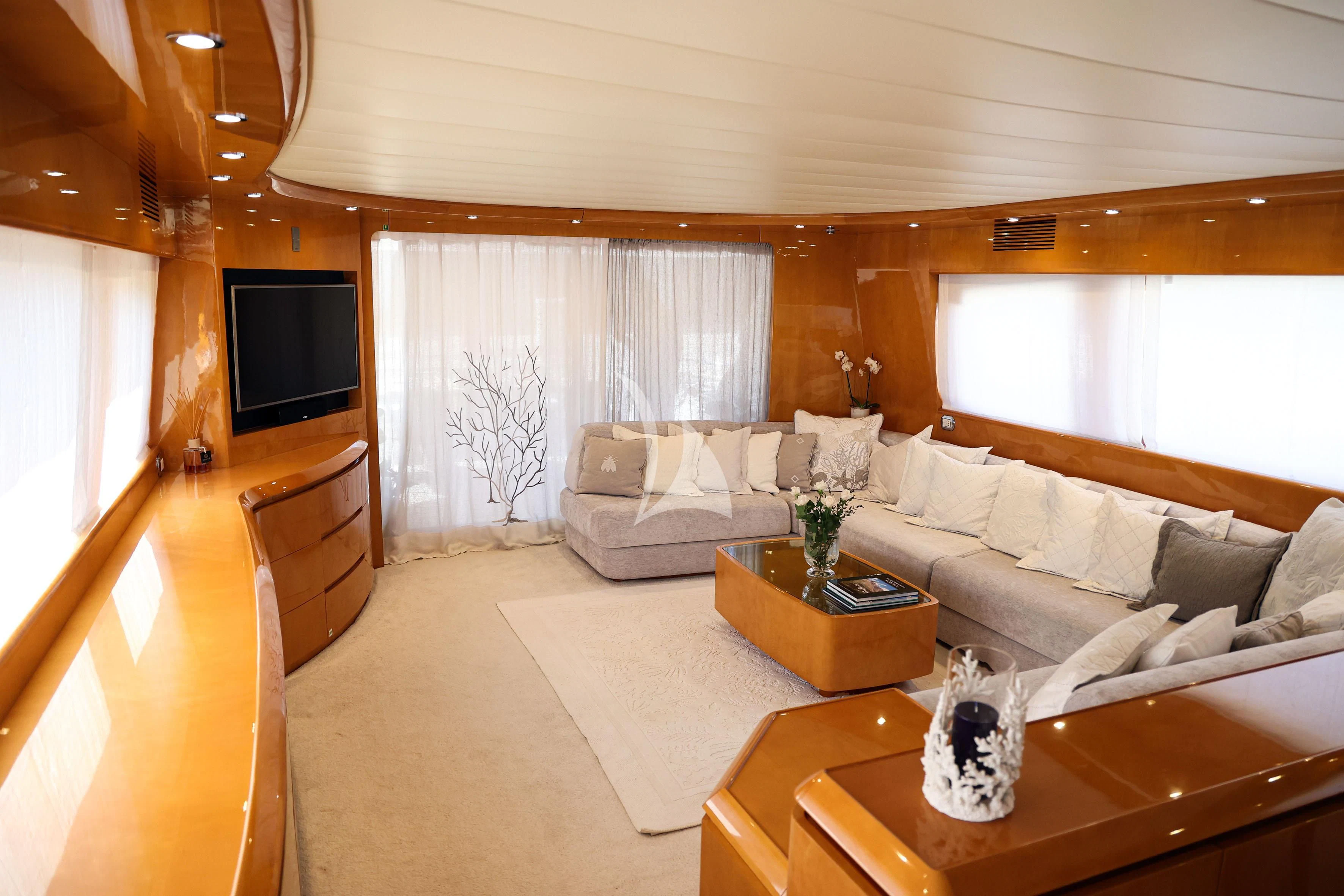 a living room with a couch and a tv aboard WILLFUL Yacht for Sale