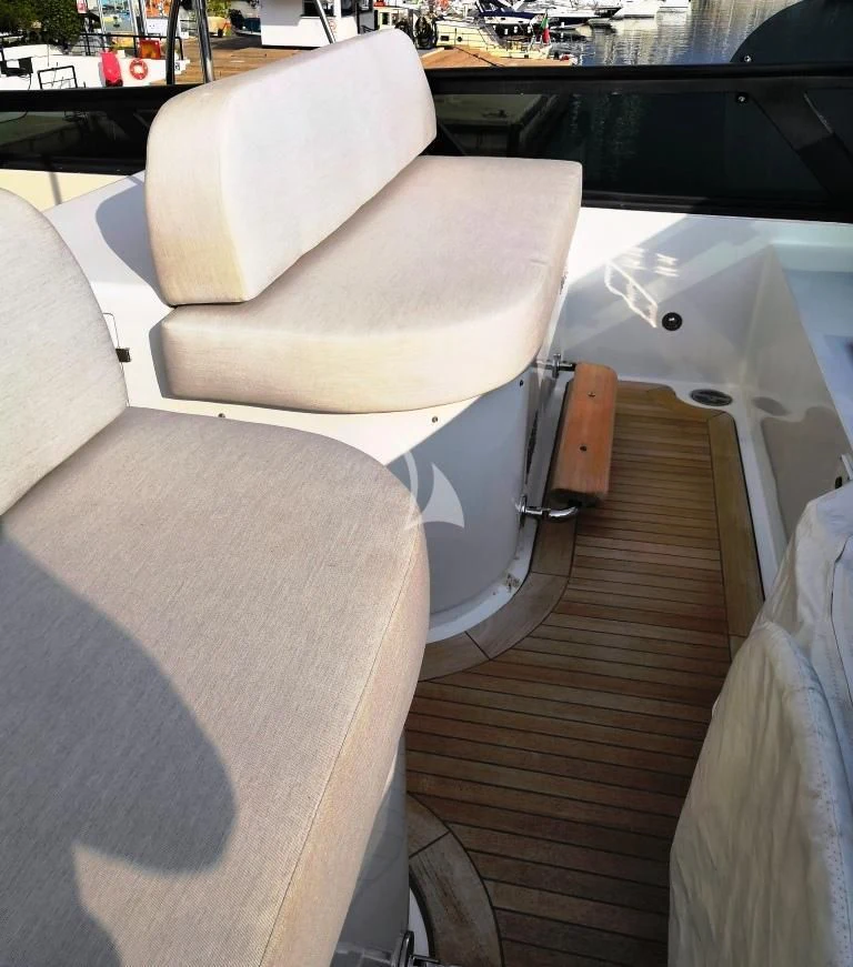 a couch with a seat aboard WILLFUL Yacht for Sale