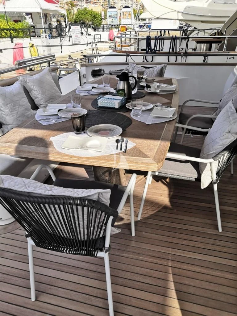 a table with chairs and a table aboard WILLFUL Yacht for Sale