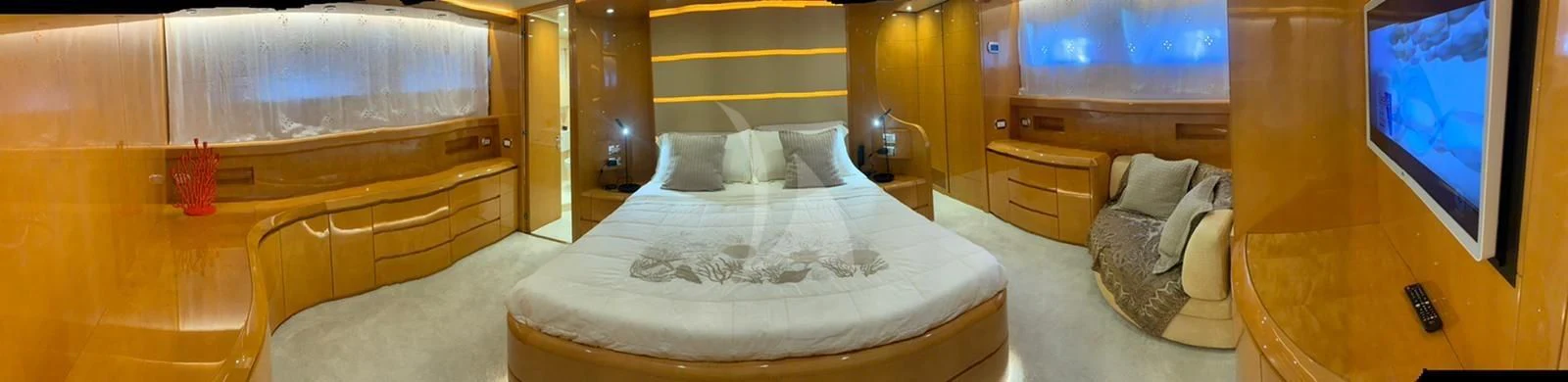 a bedroom with a bed and a television aboard WILLFUL Yacht for Sale