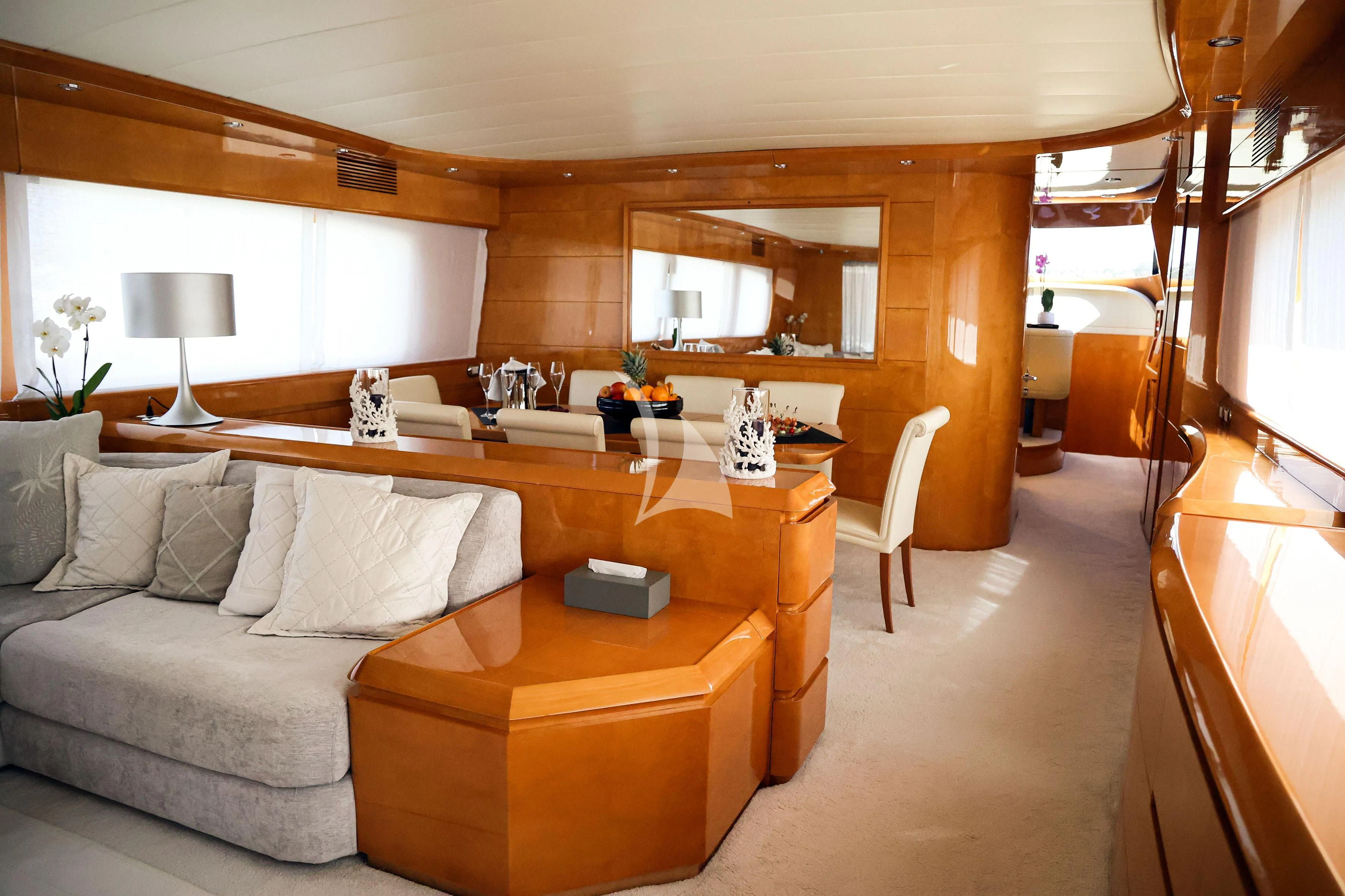 a living room with a couch and a table aboard WILLFUL Yacht for Sale
