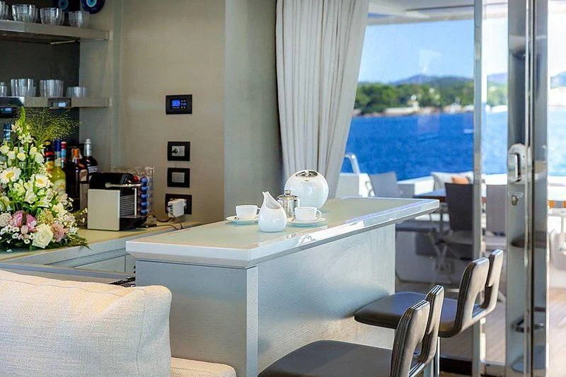 a kitchen with a table and chairs aboard WANDA Yacht for Sale