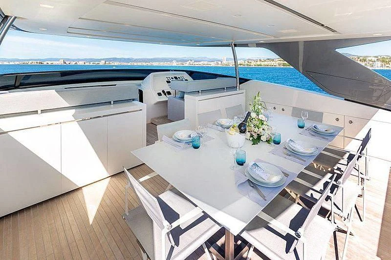 a table with plates and cups on it aboard WANDA Yacht for Sale