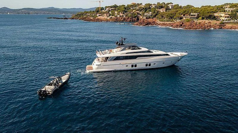 a boat and a motorboat in the water aboard WANDA Yacht for Sale