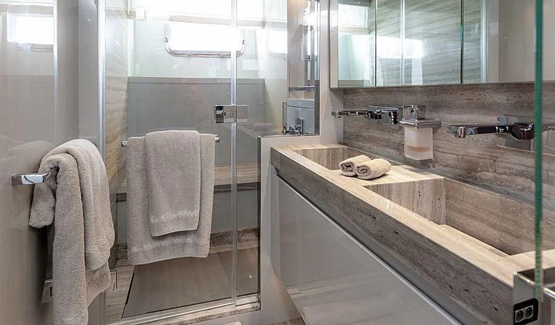 a bathroom with a sink and towels aboard WANDA Yacht for Sale