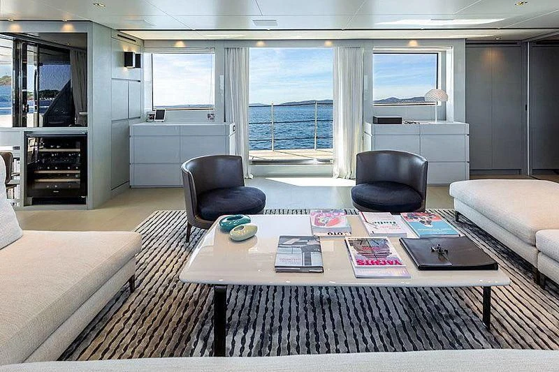 a living room with a table and chairs aboard WANDA Yacht for Sale