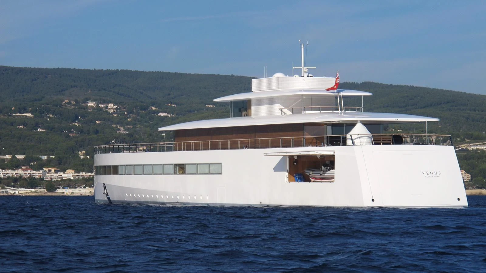 a large white boat on the water aboard VENUS Yacht for Sale