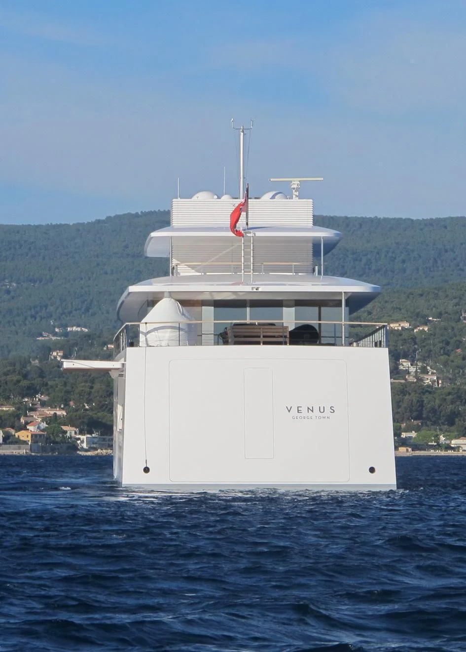 a white boat in the water aboard VENUS Yacht for Sale