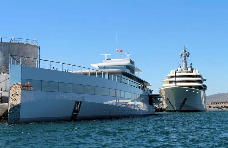a couple of large boats in the water aboard VENUS Yacht for Sale