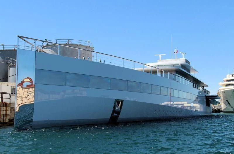 a large ship in the water aboard VENUS Yacht for Sale