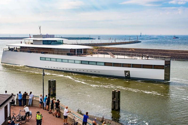 a large ship in the water aboard VENUS Yacht for Sale