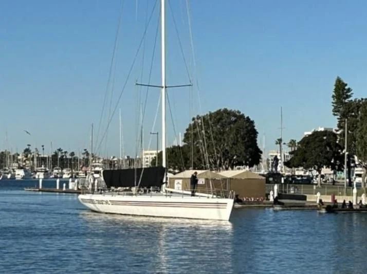 a sailboat docked at a pier aboard CHRISTINE Yacht for Sale