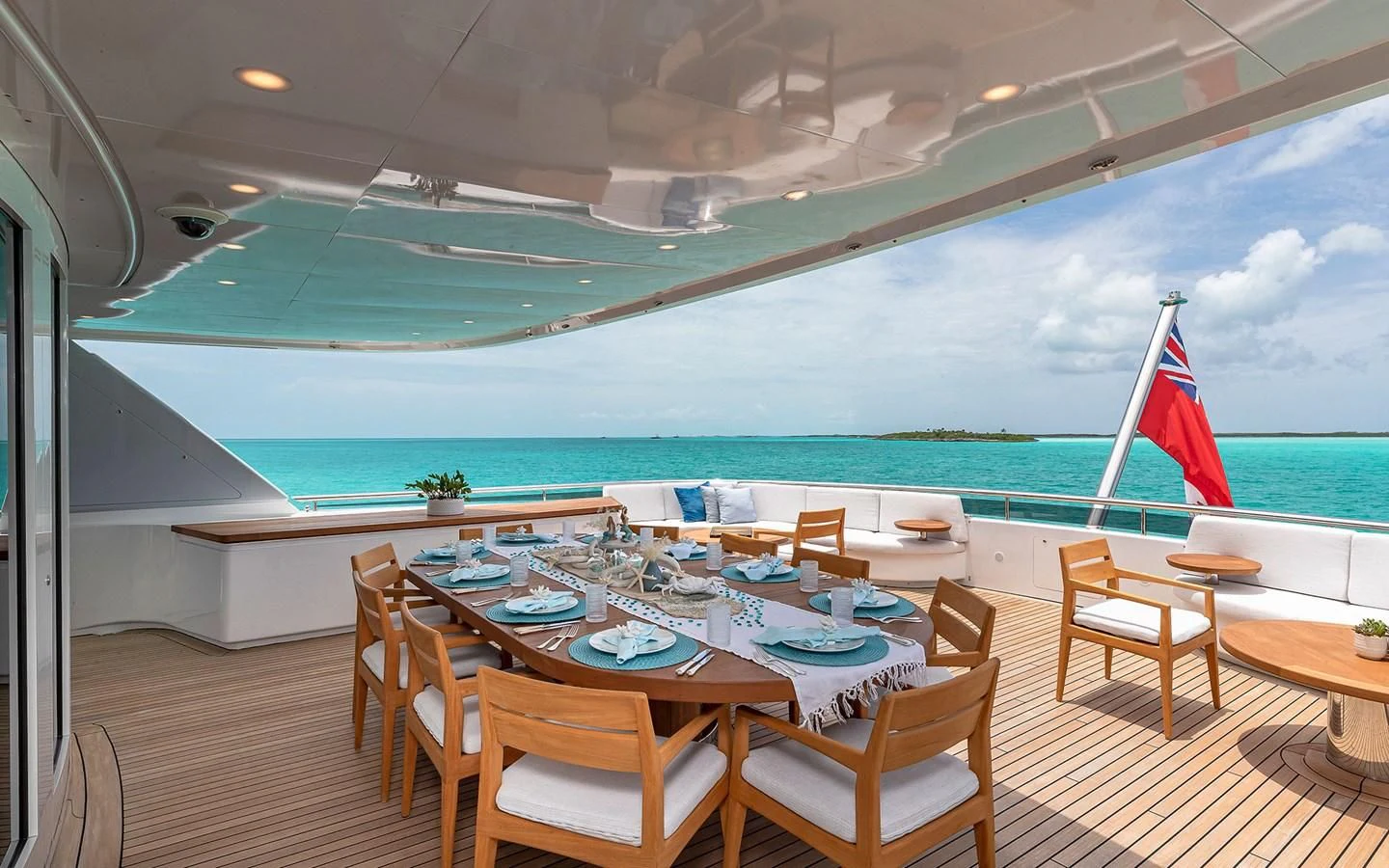 a table and chairs on a deck aboard REVERIE Yacht for Sale