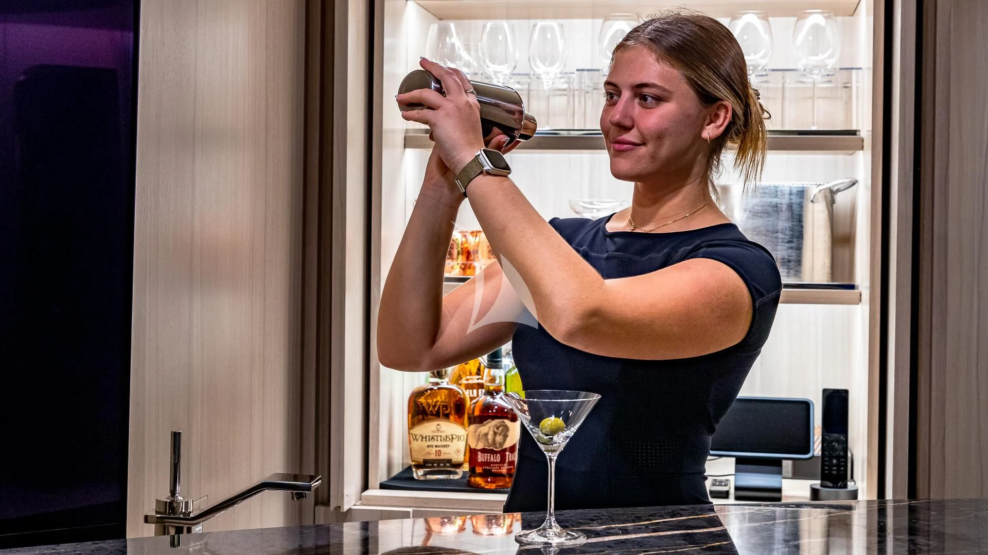 a woman drinking from a glass aboard REVERIE Yacht for Sale