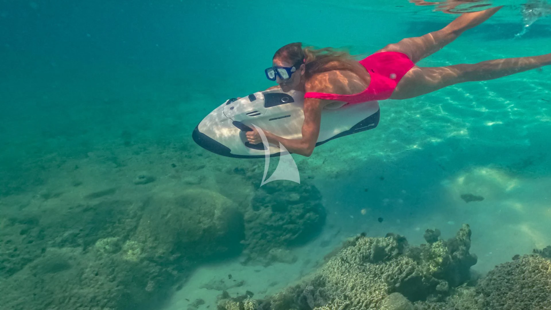 a man swimming underwater aboard REVERIE Yacht for Sale
