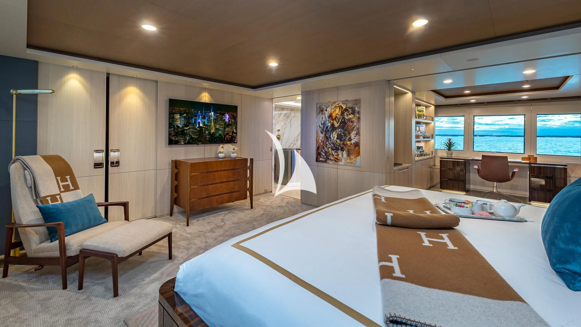 a bedroom with a bed and a desk aboard REVERIE Yacht for Sale