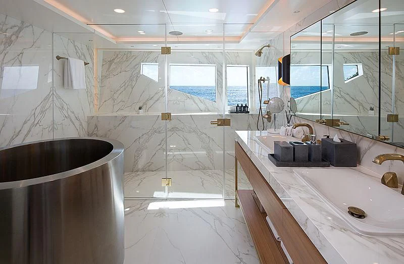 a bathroom with a large tub aboard REVERIE Yacht for Sale