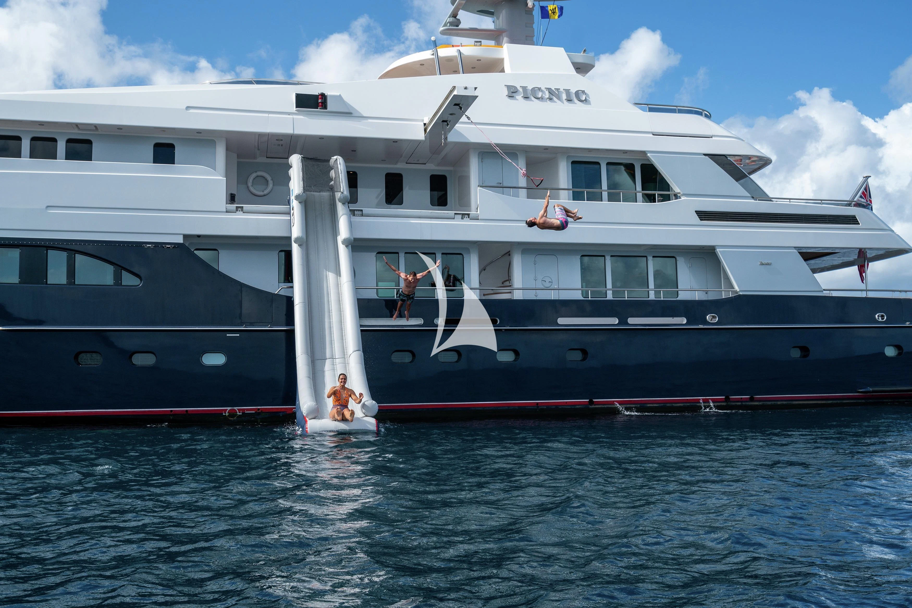 a large white boat with people on it aboard REVERIE Yacht for Sale