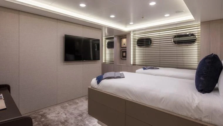 a room with two beds aboard REVERIE Yacht for Sale