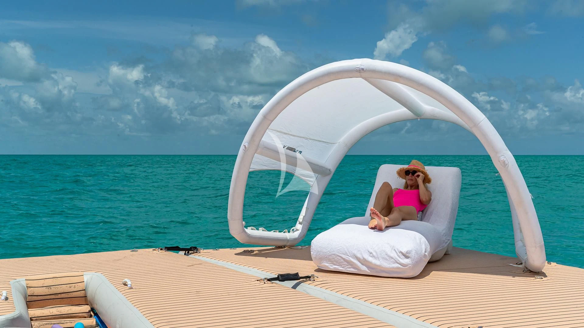 a person sitting on a boat aboard REVERIE Yacht for Sale