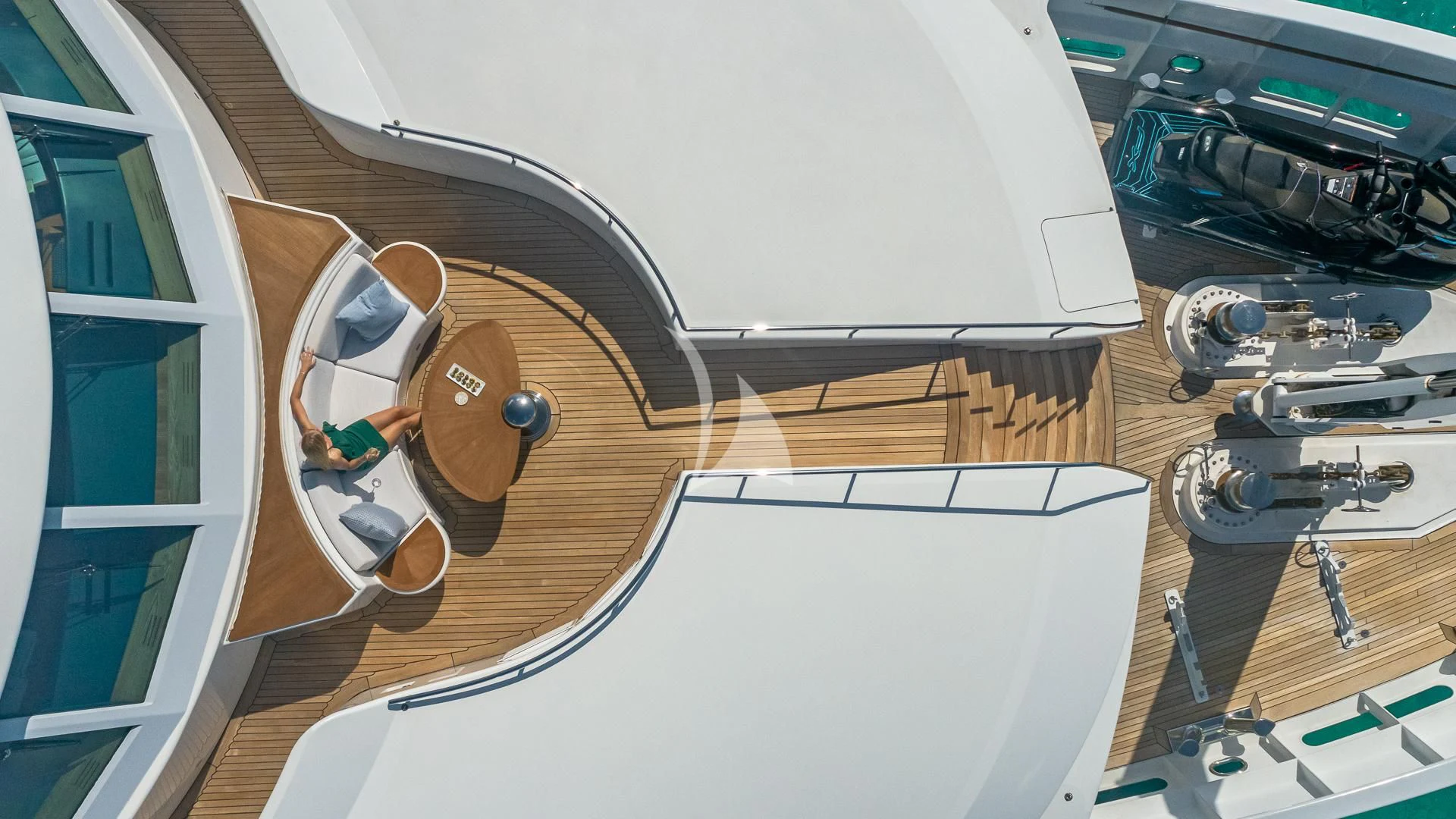 a person sitting in a chair aboard REVERIE Yacht for Sale