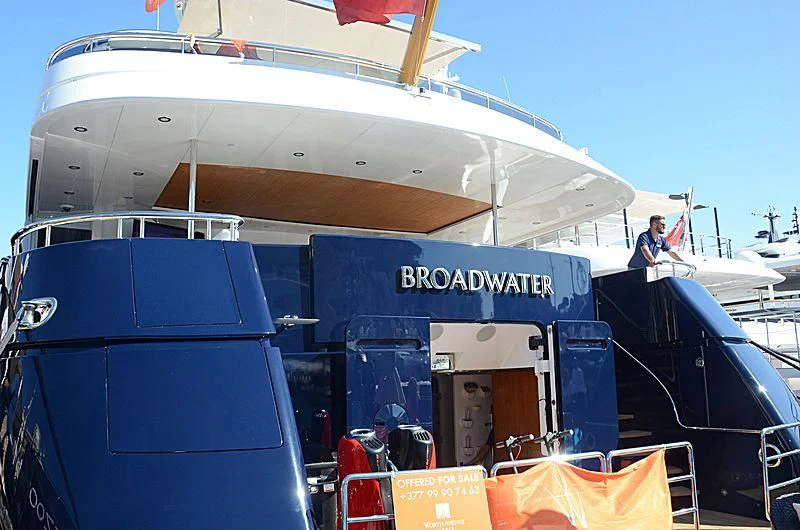 a boat with a person on the deck aboard REVERIE Yacht for Sale