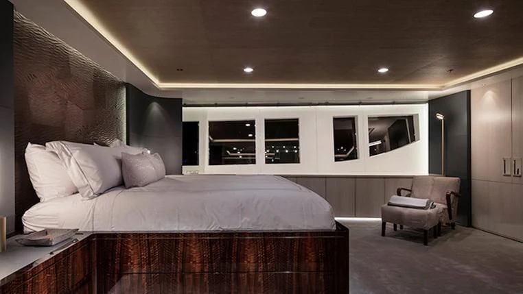 a large bed in a room aboard REVERIE Yacht for Sale
