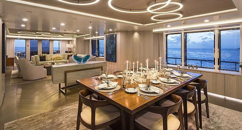a large dining room with a large table and chairs aboard REVERIE Yacht for Sale