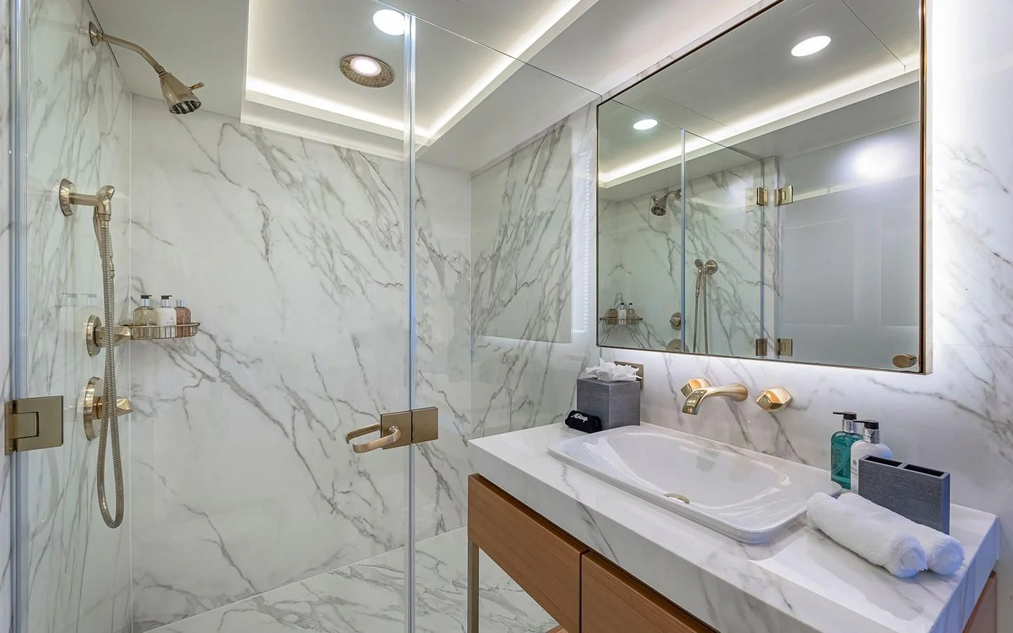 a bathroom with a shower and sink aboard REVERIE Yacht for Sale
