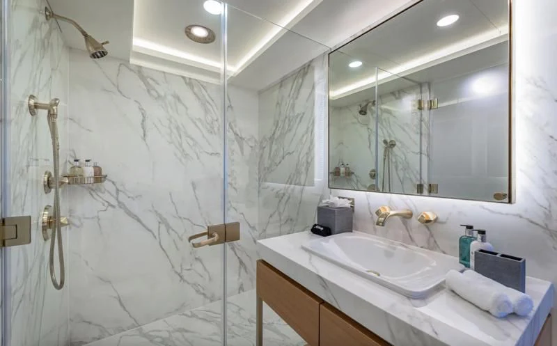 a bathroom with a shower curtain aboard REVERIE Yacht for Sale