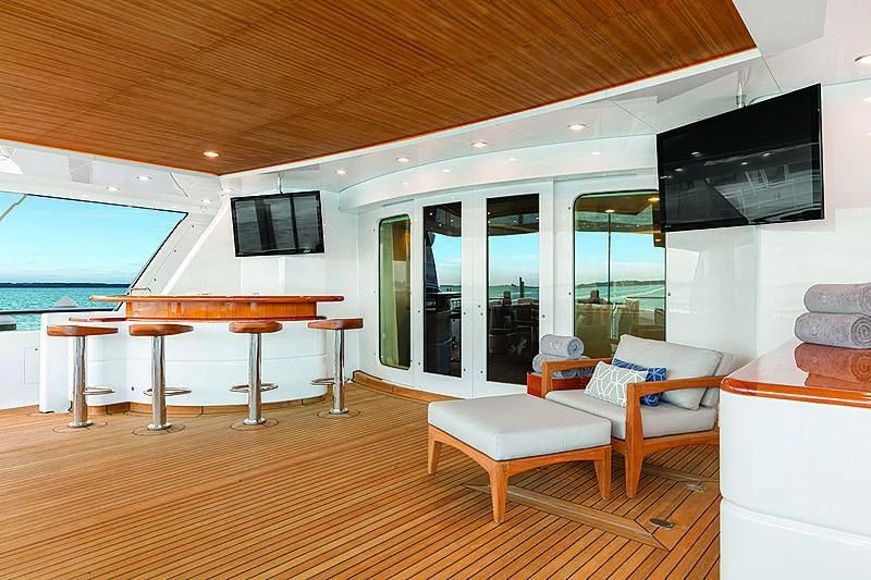 a living room with a wood ceiling aboard REVERIE Yacht for Sale