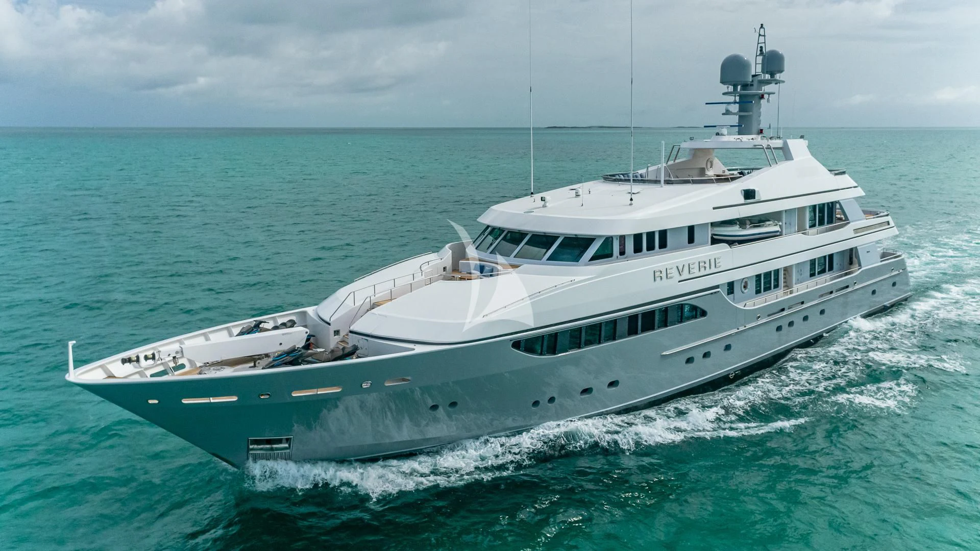 a large white boat in the water aboard REVERIE Yacht for Sale