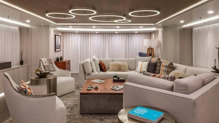 a living room with a couch and a coffee table aboard REVERIE Yacht for Sale