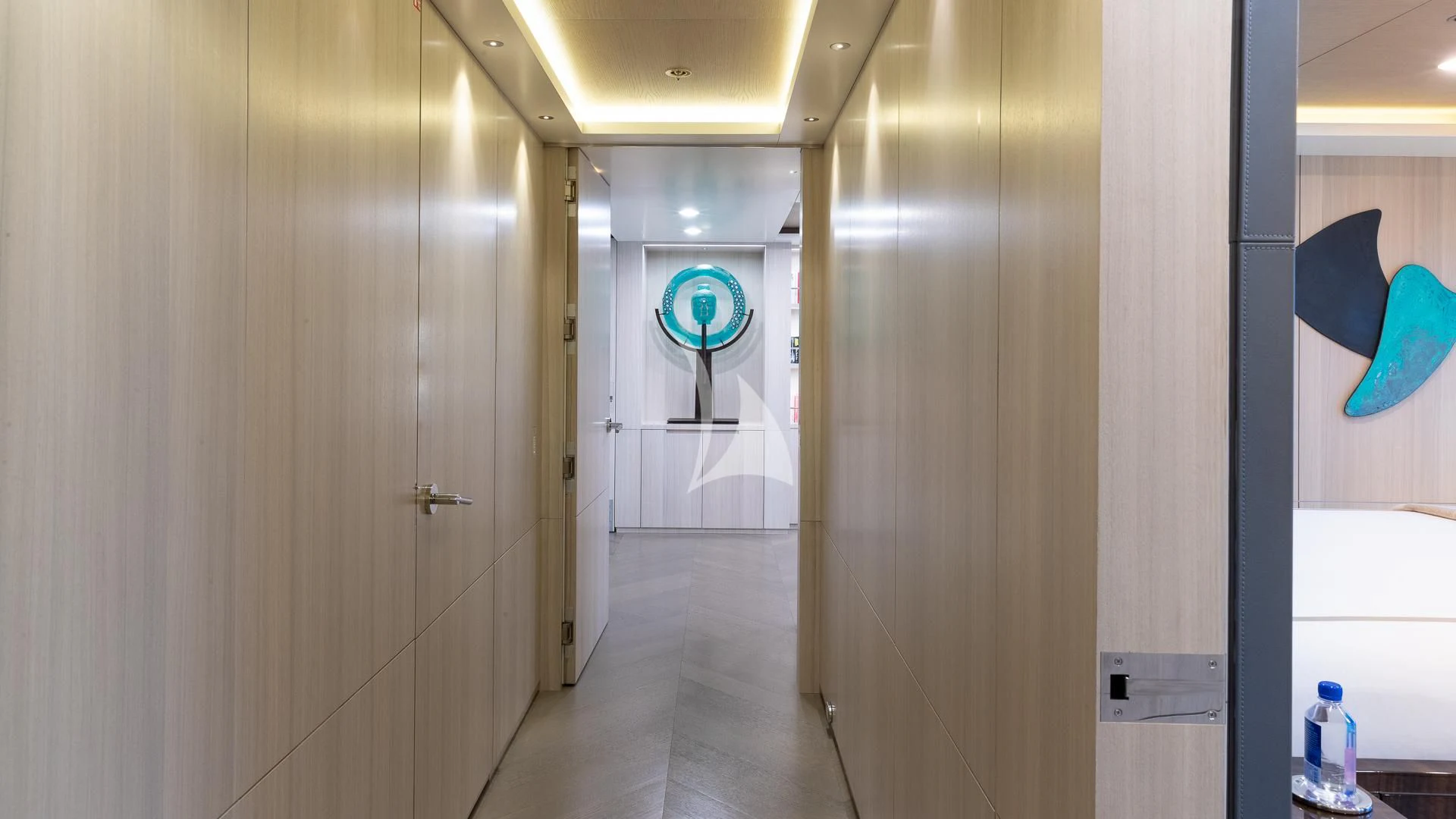 a hallway with a glass door aboard REVERIE Yacht for Sale