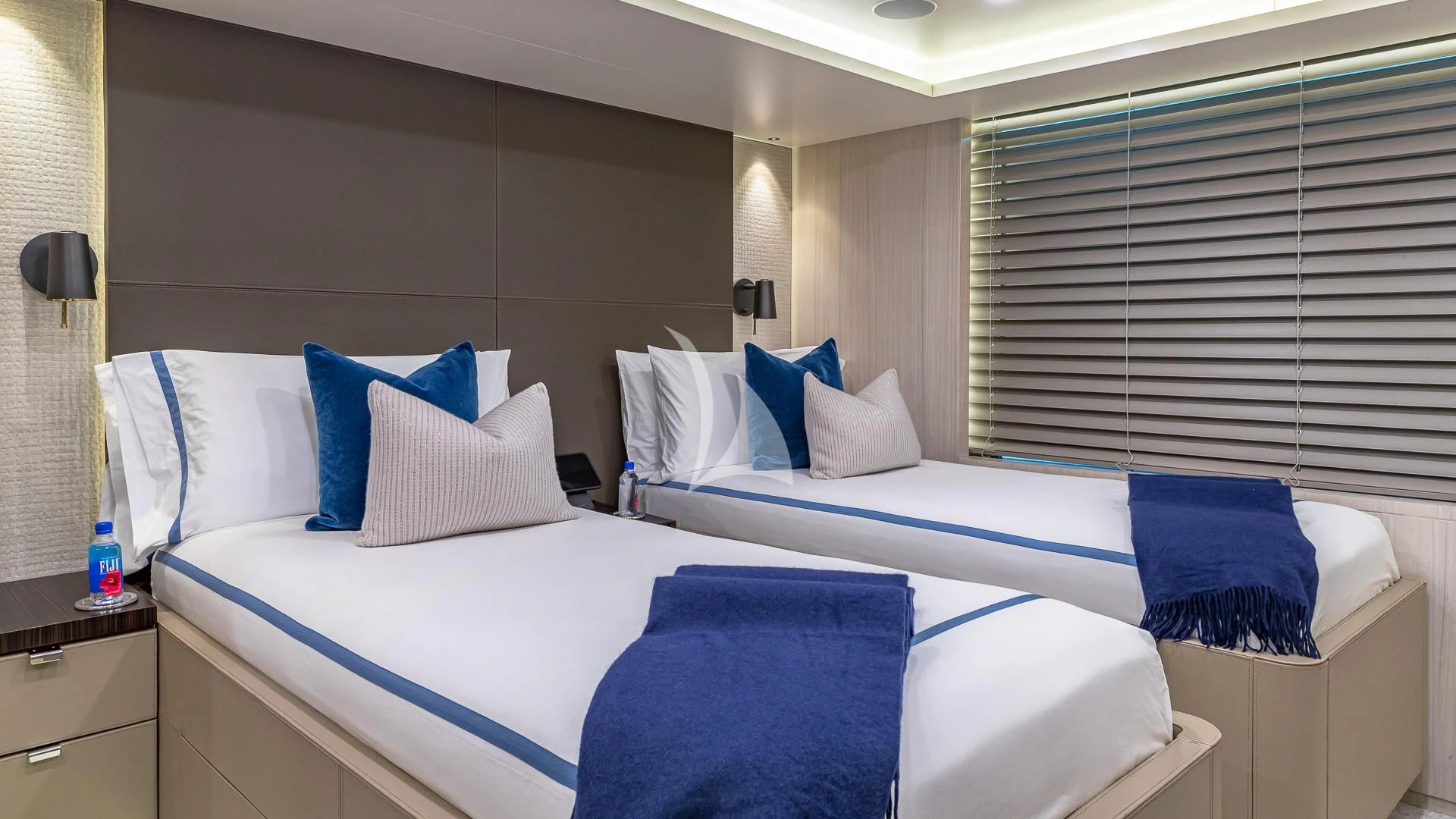 a couple of beds in a hotel room aboard REVERIE Yacht for Sale